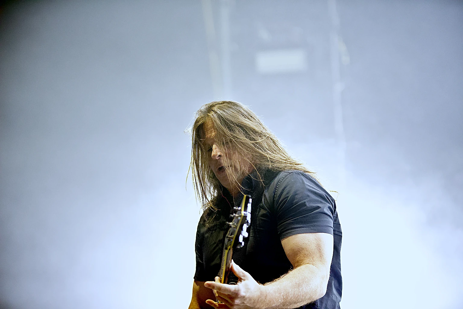 Staind guitarist playing in bright white stage haze at Toyota Arena, Ontario