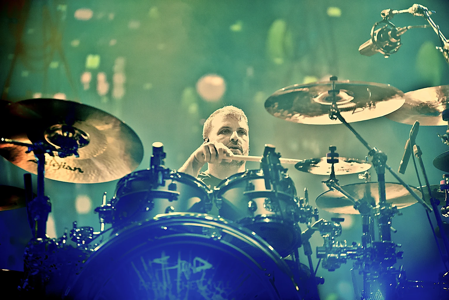 Staind drummer behind the drum kit framed by cymbals at Toyota Arena, Ontario