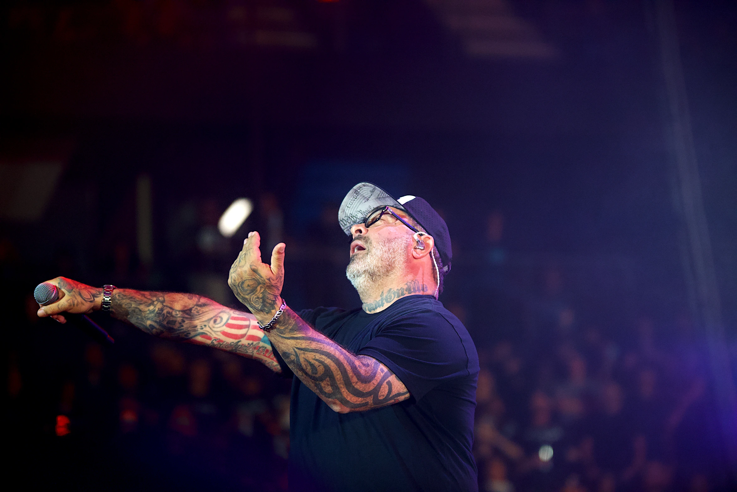 Staind vocalist Aaron Lewis pointing out toward the crowd at Toyota Arena, Ontario